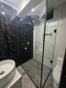 a bathroom with a sink and a toilet and a shower at Misky Samana Hotel in Espinar +7 photos