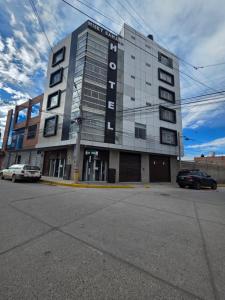 a large building on the corner of a street at Misky Samana Hotel in Espinar