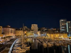 a group of boats docked in a harbor at night at Savona Casa Dolce Vita in Savona