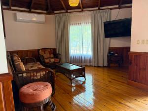 a living room with a couch and a table at Honduras Shores Plantations in Tela