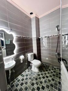 a bathroom with a toilet and a sink at velaris in Chefchaouen