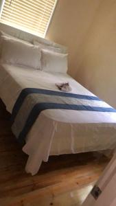 a cat laying on a bed in a bedroom at Valley Nest 758 in Castries