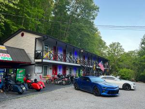 a blue car parked in front of a building at Dragon City in Maryville