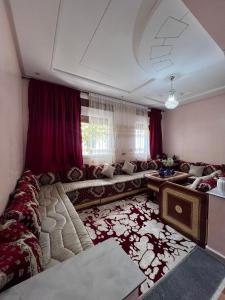 a large living room with a couch and a table at velaris in Chefchaouen