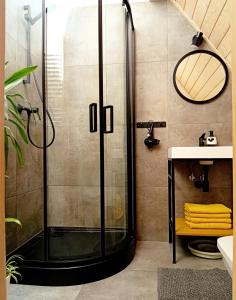 a shower with a glass door in a bathroom at Murań1 in Bukowina Tatrzańska