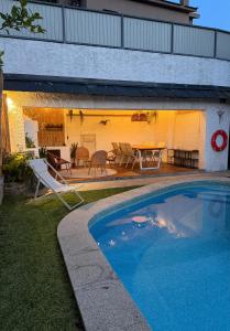 a house with a swimming pool in the yard at Miradouro 13 - Gerês in Geres