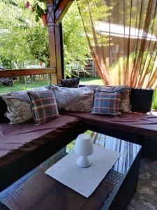 a couch sitting on top of a table at Lipora apartman in Vrnjačka Banja