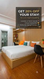 a bedroom with a large bed with a sign above it at Hanoi Discovery Travel Hotel in Hanoi