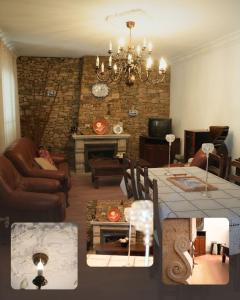 a living room with a chandelier and a dining room at Vivenda Varandas in Lagoaça