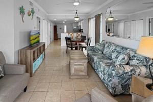 a living room with a couch and a table at 501-S - Sunset Vistas in St. Pete Beach +42 photos
