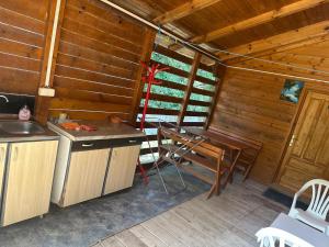 a kitchen with a desk and a table in a cabin at Bojana Breeze in Ulcinj