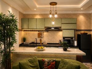 a kitchen with a large island in the middle at Kaz An Nou in Cotonou