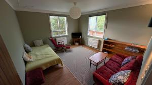 a living room with a couch and a table at Sólheimar in Blönduós