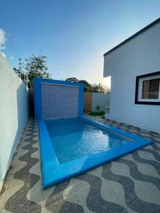 a swimming pool in the backyard of a house at Casa villeda in La Ceiba