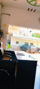 a room with a counter with a car in a garage at Hotel New Imperial inn in Chhatikara