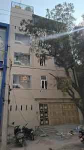 a building with two motorcycles parked in front of it at Hotel New Imperial inn in Chhatikara
