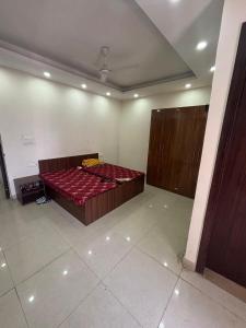 a bedroom with a red bed in a room at Hotel New Imperial inn in Chhatikara