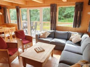 a living room with a couch and a table at Sjenharieja in Stadl an der Mur