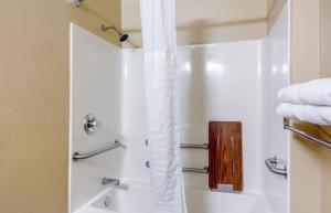 a bathroom with a shower with a shower curtain at Extended Stay America Suites - Richmond - W Broad Street - Glenside - North in Richmond +45 photos