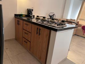 a kitchen with a stove and a counter top at Refugio Tenerife San Gil in San Gil