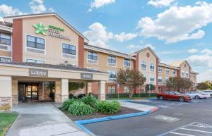 a rendering of a hotel with a parking lot at Extended Stay America Suites - Dublin - Hacienda Dr in Dublin