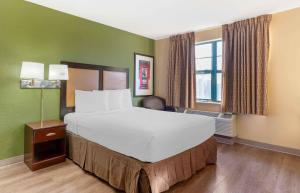 a large bed in a room with green walls at Extended Stay America Suites - Dublin - Hacienda Dr in Dublin +28 photos