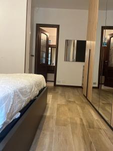 a bedroom with a bed and a large mirror at Dream Homes in Donnaz