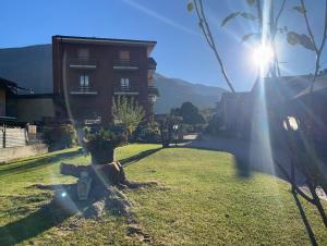 a view of a building with the sun shining at Dream Homes in Donnaz