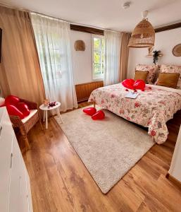 a bedroom with a bed with red pillows at Historisches Fachwerk Haus am Fluss in Monschau