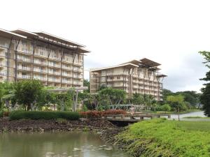 two large apartment buildings next to a river at 1BR Condo Unit in Pico De Loro in Nasugbu