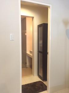 a hallway with a door leading to a closet at 1BR Condo Unit in Pico De Loro in Nasugbu +3 photos