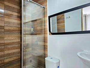 a bathroom with a toilet and a sink at 110 Loft in Cali +27 photos