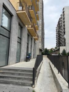 a building with stairs and a balcony on it at City View Apartments At Dadiani St in Tbilisi City