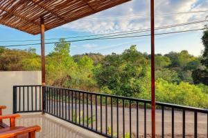 a balcony with a view of a river and trees at Villa Astella in Nusa Penida