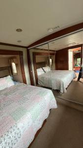 two beds in the back of a train room at Maggies Place in Ingonish