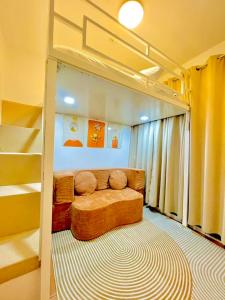a room with a bed in a bunk bed at 2BR Condo with pool at Sorrento Oasis Pasig in Manila