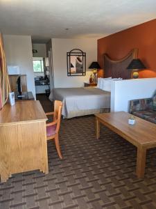 a hotel room with a bed and a couch at The Noor Hotel in Torrey