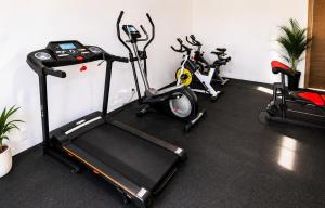 a room with three exercise bikes parked next to a wall at Magico s apartments in Playa del Carmen