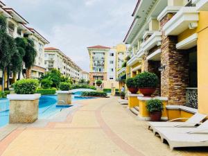 a courtyard of a apartment building with a pool at 2BR Condo with pool at Sorrento Oasis Pasig in Manila