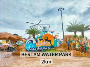 a water park sign at a water park at 4B 3R Cozy Spacious Near Dewan Millenium Fully Aircond in Kepala Batas