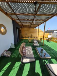 a living room with a couch and a table at Rabat hassan in Rabat