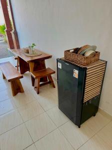 a room with a table and a small table with a basket at South Hill Pandawa in Nusa Dua