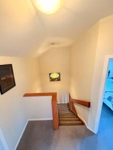 a staircase in a house with a ceiling at Cozy Escape in Wanaka