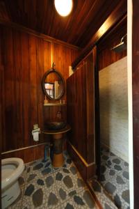 a bathroom with a sink and a toilet at KhounPhet Hotel in Luang Prabang