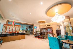 a store with blue chairs and a restaurant at Rimkhobfa Urban Resort in Samutprakarn
