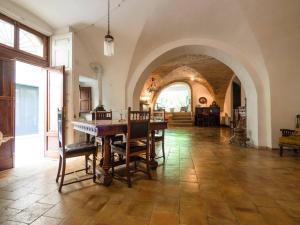 a large room with a table and chairs in it at Le Foglie Di Acanto in Lucera