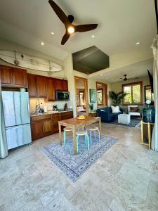 a kitchen and living room with a table and a ceiling fan at Hilltop View Sanctuary in Fallbrook