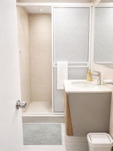 a bathroom with a shower and a sink and a toilet at Getaway at Fragata Style with Ocean View in Cartagena de Indias