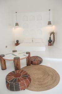 a bedroom with a bed and a table and a rug at bassa resort in Panglao Island +39 photos