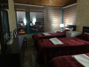 Voodi või voodid majutusasutuse Isra Hotel toas